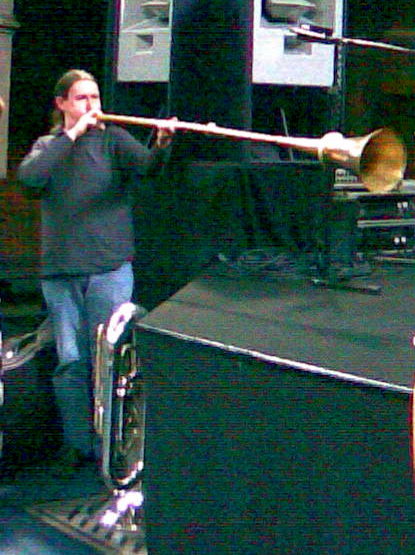Long and made of brass