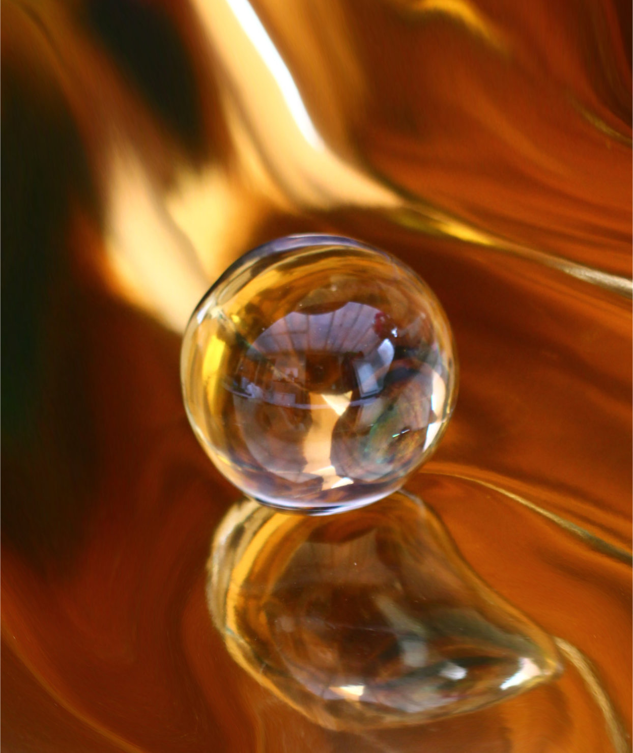Gold Ball - Crystal ball on gold background